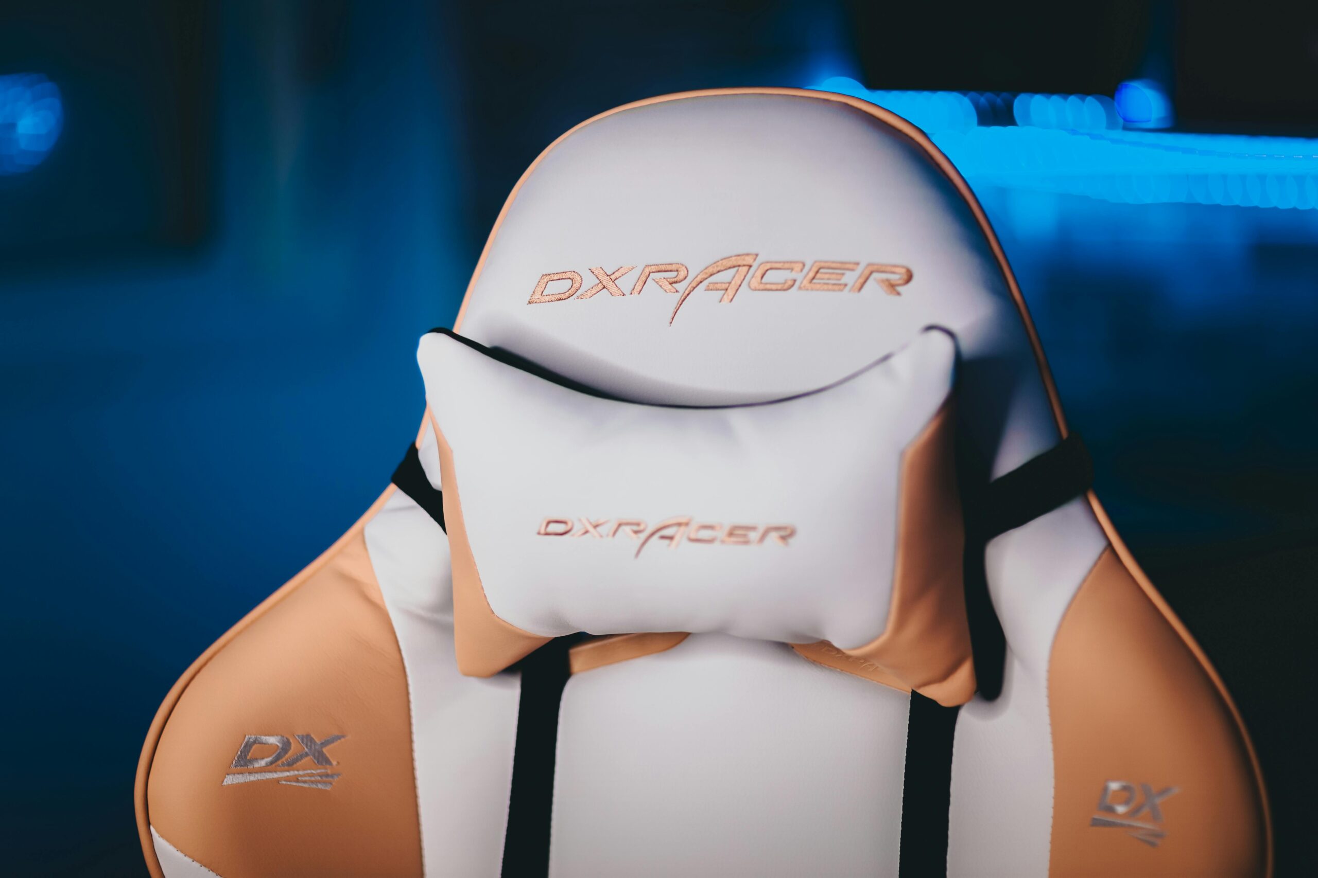 Ergonomic gaming chair with neck pillow, ideal for gamers and home offices.